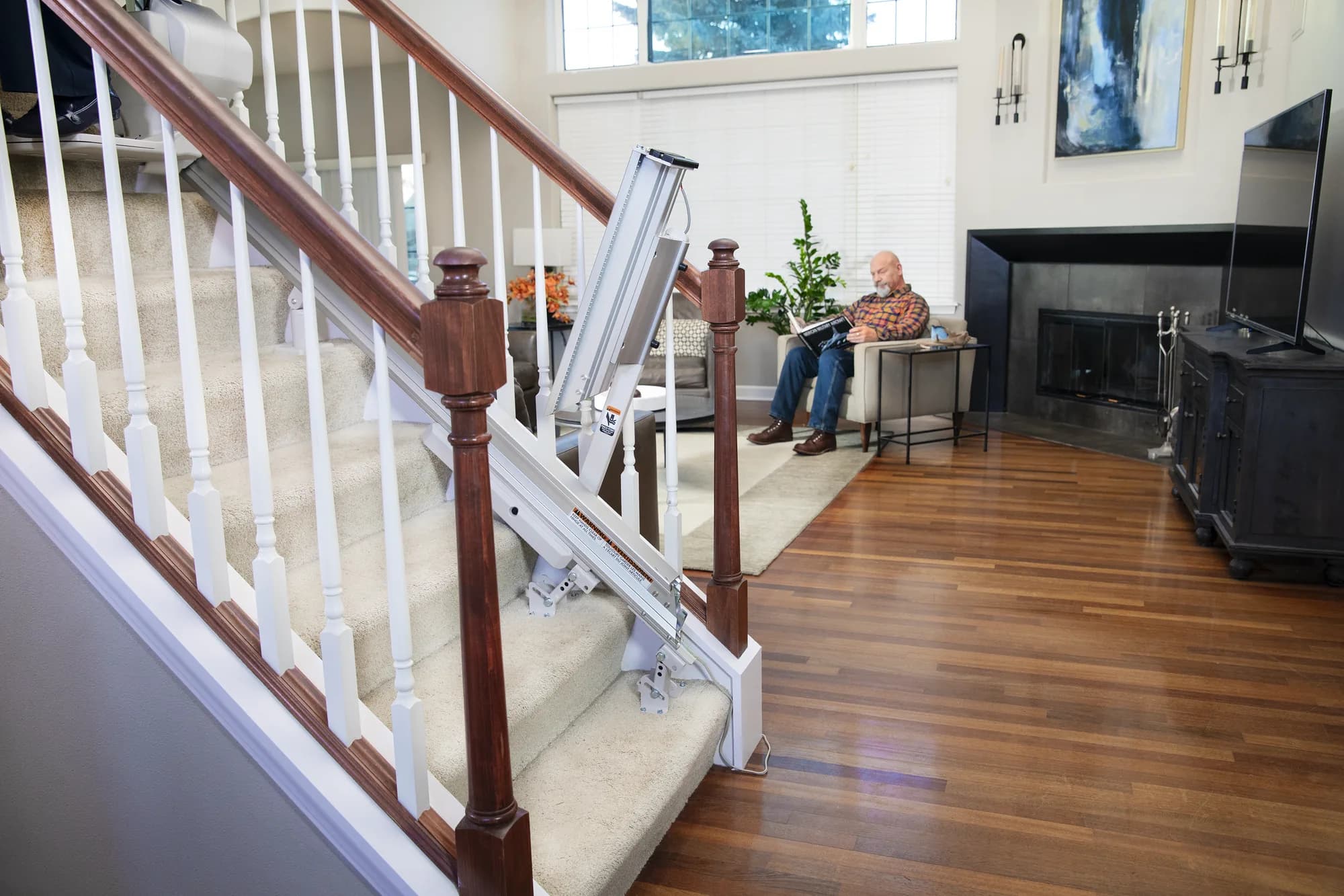 Bruno Elan SRE-5000 Power stairlift with the power folding rail in the up position, keeping the bottom of the stairs clear